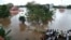 Indian residents look at the Shiva Temple submerged after the release of water from Idamalayar dam following heavy rains in Kochi on Aug. 9, 2018.