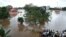 Indian residents look at the Shiva Temple submerged after the release of water from Idamalayar dam following heavy rains in Kochi on Aug. 9, 2018.