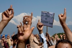 FILE - Kashmiris shout freedom slogans during a protest against New Delhi's tightened grip on the disputed region, on the outskirts of Srinagar, Indian-controlled Kashmir, Aug. 23, 2019.