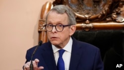 FILE - Gov. Mike DeWine speaks at the Ohio Statehouse in Columbus, March 5, 2019. DeWine signed a tough abortion restriction bill into law in April, but a federal judge on July 3 temporarily blocked it.