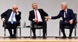 FILE - Bertie Ahern, Tony Blair and Bill Clinton attend an event to celebrate the 20th anniversary of the Good Friday Agreement, in Belfast, Northern Ireland, Apr. 10, 2018.