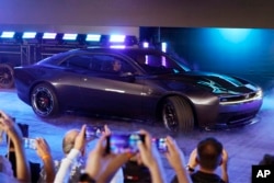 The Dodge Charger Daytona SRT concept is unveiled, Wednesday, Aug. 17, 2022, in Pontiac, Mich. (AP Photo/Carlos Osorio)