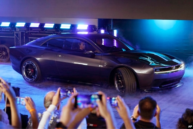 The Dodge Charger Daytona SRT concept is unveiled, Wednesday, Aug. 17, 2022, in Pontiac, Mich. (AP Photo/Carlos Osorio)