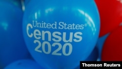 FILE - Balloons decorate an event for activists and local government leaders to mark the one-year-out launch of the 2020 census efforts in Boston, April 1, 2019. 