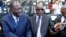 Le président guinéen Alpha Condé (à dr.) avec son homologue ivoirien Alassane Ouattara lors d'une cérémonie marquant le 75e anniversaire du débarquement allié en Provence pendant la Seconde Guerre mondiale, à Saint-Raphaël, en France, le 15 août 2019.