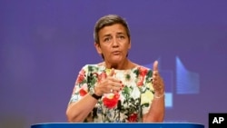 FILE - European Antitrust Commissioner Margrethe Vestager talks during a news conference at the European Commission headquarters in Brussels, Belgium, July 18, 2019.