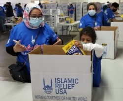 Packing food boxes in Springfield, Virginia, for the needy, sponsored by Islamic Relief USA, an international humanitarian organization in Alexandria, Virginia. (Courtesy Islamic Relief USA)