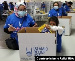 Packing food boxes in Springfield, Virginia, for the needy, sponsored by Islamic Relief USA, an international humanitarian organization in Alexandria, Virginia. (Courtesy Islamic Relief USA)