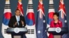 Australia's Prime Minister Tony Abbott (L) speaks next to his South Korean counterpart Park Geun-hye during a news conference at the presidential house in Seoul, April 8, 2014.