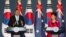 Australia's Prime Minister Tony Abbott (L) speaks next to his South Korean counterpart Park Geun-hye during a news conference at the presidential house in Seoul, April 8, 2014.