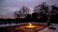 The eternal flame flickers in the early morning light at the grave of John F. Kennedy at Arlington National Cemetery on the 50th anniversary of Kennedy's death.