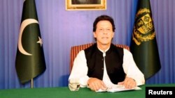 FILE - Pakistan's Prime Minister Imran Khan speaks to the nation in his first televised address in Islamabad, Pakistan, Aug. 19, 2018. 