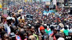 Guinea's opposition supporters walk during a demonstration in Conakry, Aug. 2, 2017. 