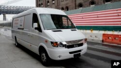 This Nov. 2, 2017, photo shows a Chanje V8070 electric medium-duty truck on display in New York. 