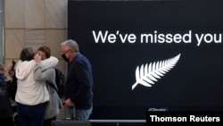 New Zealand travellers are seen as quarantine-free travel between Australia and New Zealand begins, at Sydney International Airport