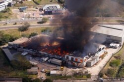 A general view of a burning warehouse after violence erupted following the jailing of former South African President Jacob Zuma, in Durban, July 14, 2021.