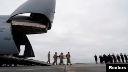 FILE - U.S. President Joe Biden and other officials attend the transfer of the remains of Army Reserve Sergeants William Rivers, Kennedy Sanders and Breonna Moffett, who were killed in Jordan during a drone attack, at Dover Air Force Base in Dover, Delaware, on Feb. 2, 2024.