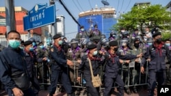 FILE - Police move to strengthen barriers with pro-democracy protesters during a rally, Dec. 10, 2020 in Bangkok, Thailand.