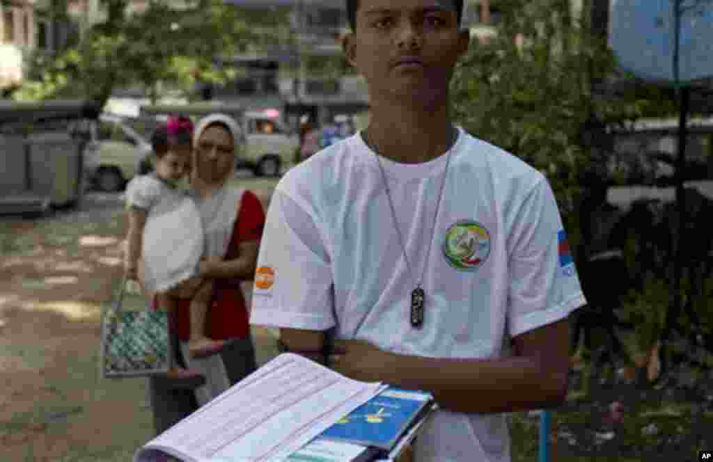 A Myanmar census volunteer stands in a Muslim neighborhood collecting information in Yangon, Myanmar, Sunday, Mar 30, 2014. Enumerators fanned out across Myanmar on Sunday for a census that has been widely criticized for stoking religious and ethnic tensi