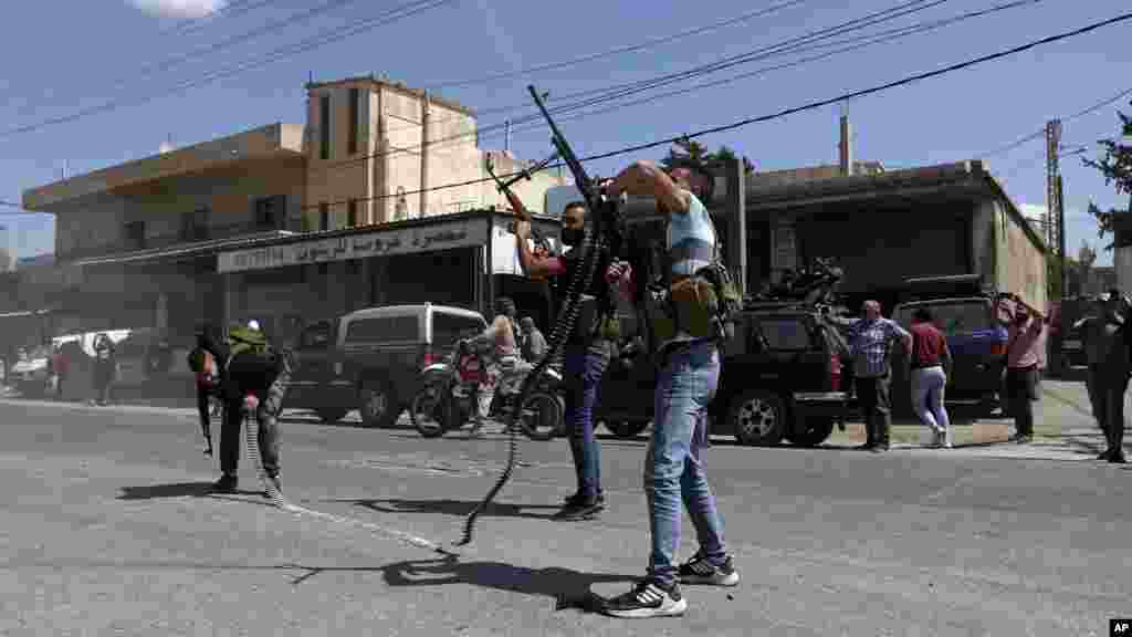 Hezbollah supporters fire in the air to celebrate the arrival of Iranian fuel tankers to Lebanon, in the eastern town of Baalbek.&nbsp;The delivery violates U.S. sanctions imposed on Tehran after former President Donald Trump pulled America out of a nuclear deal between Iran and world powers three years ago.&nbsp;