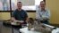 Dr. Ruben Martinez (R), from the Universidad Nacional de la Patagonia San Juan Bosco, and Dr. Matt Lamanna from the Carnegie Museum of Natural History, pose with the skull and neck bones of the new titanosaurian dinosaur species Sarmientosaurus musacchioi in this undated picture. (Courtesy: Matt Lamanna)  