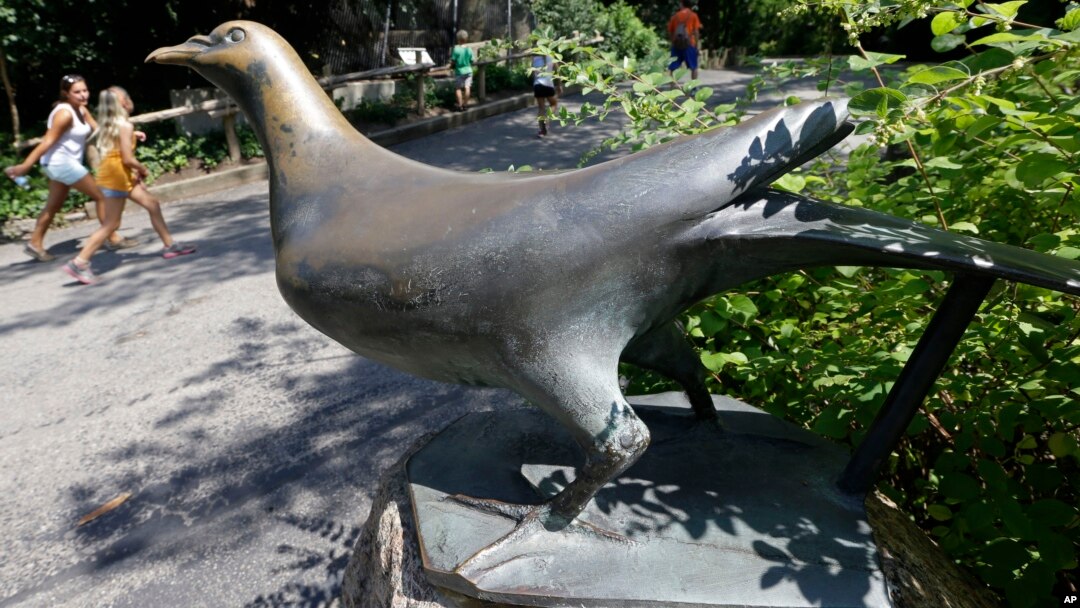 FILE - A statue of Martha, the last passenger pigeon, stands at the Cincinnati Zoo in Cincinnati, Ohio, July 18, 2013. Martha died on Sept. 1, 1914, at the reported age of 29.