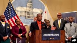 FILE — Assemblymember Reggie Jones-Sawyer, D-Los Angeles, speaks about a package of reparations legislation at a press conference at the state Capitol on February 21, 2024.