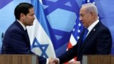 U.S. Secretary of State Marco Rubio and Israeli Prime Minister Benjamin Netanyahu shake hands during a joint press conference at the prime minister's office in Jerusalem on February 16, 2025.