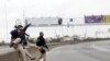 Federal police officers are seen at the Rio-Niteroi Bridge, where armed police surrounded a hijacked passenger bus in Rio de Janeiro, Brazil.