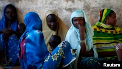 Internally displaced women from Bangui attend a community meeting in Bambari, Central Africa Republic, June 16, 2014.