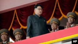 FILE - North Korean leader Kim Jong Un watches parade participants from a balcony at the Kim Il Sung Square in Pyongyang, North Korea, May 10, 2016.