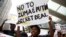 FILE - Environmental activists protest against the use of nuclear power in Durban, South Africa, Dec. 14, 2016. 