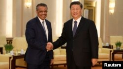 Tổng giám đốc Tedros Adhanom Ghebreyesus trong cuộc gặp với Chủ tịch Trung Quốc Tập Cận Bình khi tới Trung Quốc cuối tháng Một năm nay.