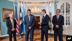 FILE - Secretary of State Antony Blinken, center right, meets with, from left, Marshall Islands Foreign Affairs and Trade Minister Jack Ading, Palau President Surangel Whipps, Jr., and Micronesia President Wesley Simina, Sept. 26, 2023, at the State Department in Washington. 