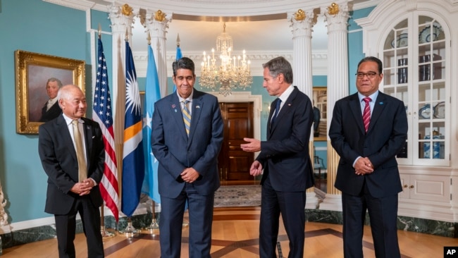 FILE - Secretary of State Antony Blinken, center right, meets with, from left, Marshall Islands Foreign Affairs and Trade Minister Jack Ading, Palau President Surangel Whipps, Jr., and Micronesia President Wesley Simina, Sept. 26, 2023, at the State Department in Washington.