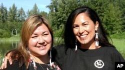 FILE - Rochelle Adams (L), an Alaska Native cultural advisor, and Princess Johnson, the creative producer for the series "Molly of Denali" appear at the Alaska Native Heritage Center in Anchorage, Alaska, June 19, 2019.