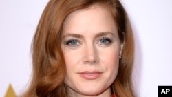 Amy Adams arrives at the 86th Oscars Nominees Luncheon, on Monday, Feb., 10, 2014.