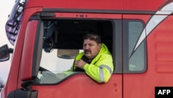 A Polish truck driver takes part in a border blockade near Hrebenne, Poland, on Dec. 4, 2023. Truckers are protesting what they call "unfair" competition from Ukrainian companies. The blockade is causing delays getting material to Ukraine's battlefields as it fights Russia.