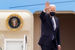 President Joe Biden waves from the top of the steps of Air Force One at Andrews Air Force Base, Md., March 16, 2021, as he prepares to depart for a trip to Pennsylvania.