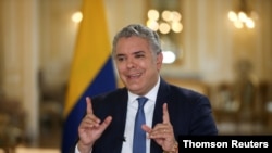 FILE - Colombia's President Ivan Duque speaks during an interview with Reuters in Bogota, Colombia, Oct. 16, 2020. 