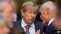 FILE - Former U.S. Solicitor General Ted Olson, center, speaks with former Homeland Security Secretary Michael Chertoff at the FBI Building in Washington, Sept. 28, 2017. Olson died on Wednesday. He was 84. 