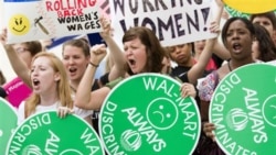 Demonstrators outside the Supreme Court in Washington, protesting the decision in the Wal-Mart case