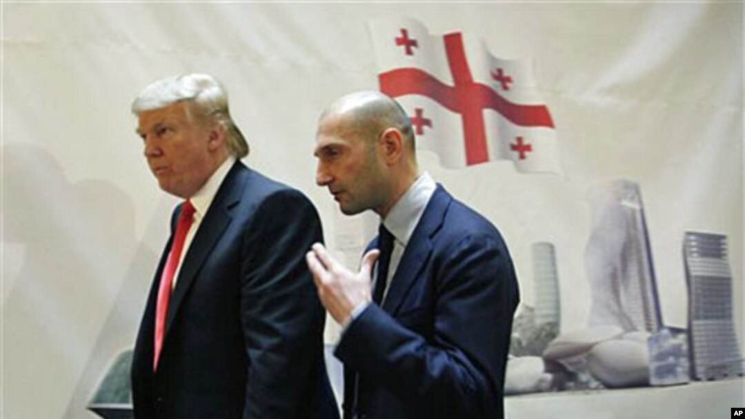 Real estate developer Donald Trump, left, and George Ramishvili, Chairman of Silk Road Group, talk following a news conference in New York, March 10, 2011