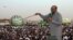 President Omar Hassan al-Bashir addresses a crowd, orders stoppage of all South Sudan's oil exports, in North Khartoum, Sudan, June 8, 2013.