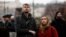 People observe a minute of silence commemorating the victims of a shooting at one of Charles University's buildings, in Prague, Czech Republic, on Dec. 23, 2023.