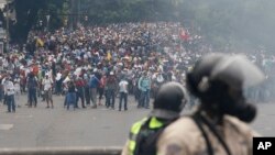 Opponents of President Nicolas Maduro march in Caracas, Venezuela, April 20, 2017.