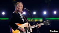FILE - Canadian singer-songwriter Gordon Lightfoot performs during the halftime show during the 100th CFL Grey Cup championship football game in Toronto, Canada Nov. 25, 2012. 