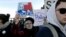 FILE - Protesters march in Chicago before a rally with Republican presidential candidate Donald Trump at the University of Illinois-Chicago, March 11, 2016. Trump's strong language throughout his campaign has drawn in some supporters perceived as hate-filled extremists.