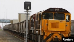 FILE - An empty coal train sits on the tracks at the Port of Brisbane, Jan. 15, 2011.