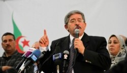 FILE - Then-Algerian Prime Minister Ahmed Ouyahia speaks during a meeting the National Democratic Rally in Algiers, May 5, 2012.